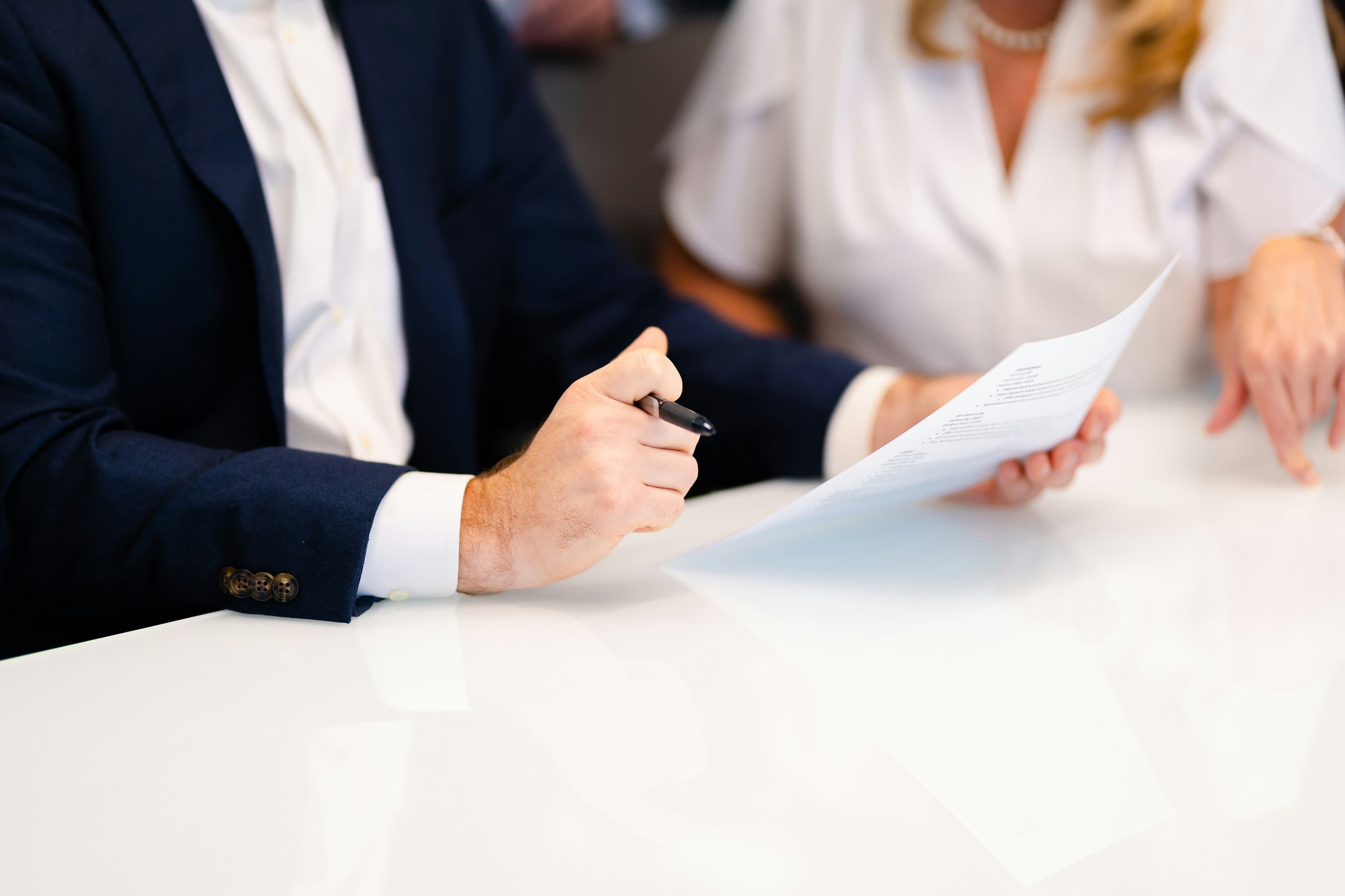 Notary and clients reviewing documents together